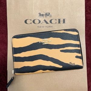 Sold Coach year of the tiger medium ID zip wallet